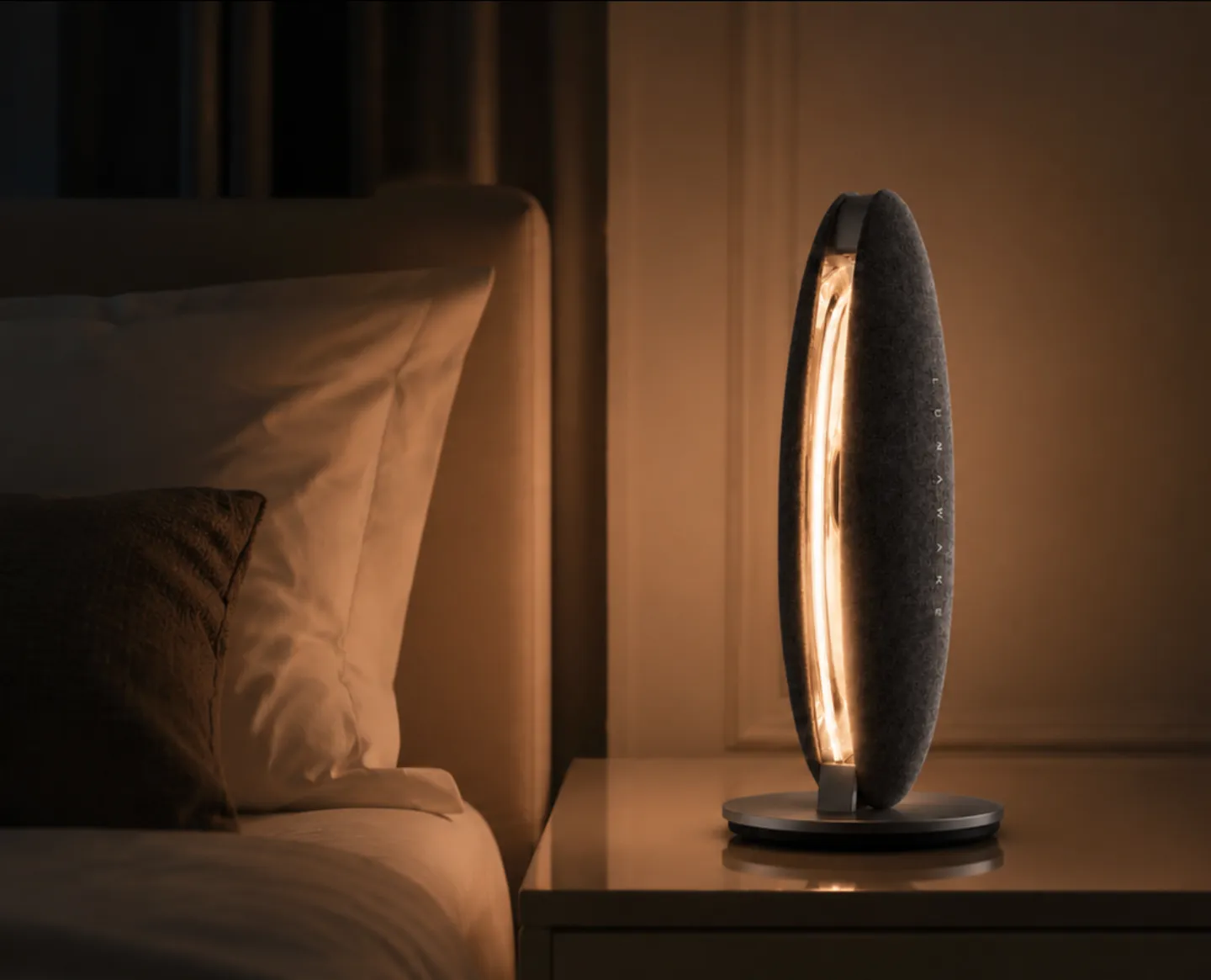 LunaWake glowing on a bedside table in a quiet bedroom